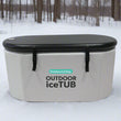 Load image into Gallery viewer, An Outdoor Living IceTUB, which is a white, round ice bath with a black lid and straps, designed for cold therapy.
