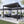 Load image into Gallery viewer, Aluminium Pergola with Louvred Shutter Roof 3 x 3m - Como
