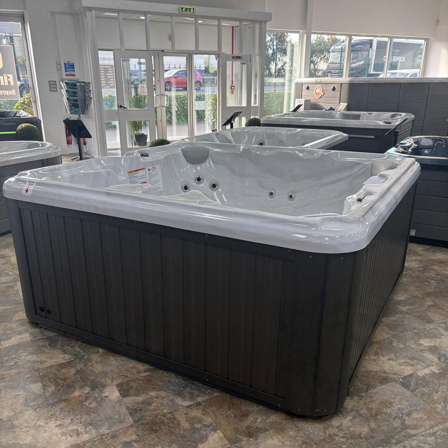 Hot tub in a showroom with large windows
