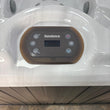 Load image into Gallery viewer, Control panel of a Sundance hot tub with a person&#39;s feet at the bottom.
