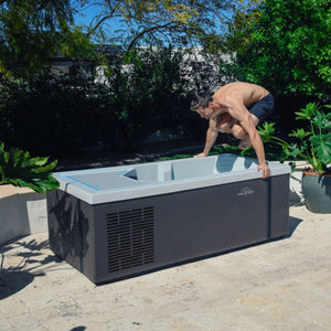 Man jumping into an ice bath