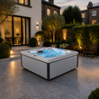 Load image into Gallery viewer, Edge Kensington Hot Tub in Light Grey - London house garden late dusk lifestyle - August 2026
