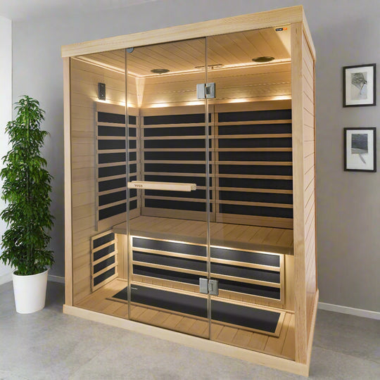 A roomy Tylö T825H infrared sauna designed for three people, featuring clear Hemlock wooden construction and equipped with infrared panels, LED lighting, and a touchscreen control panel.