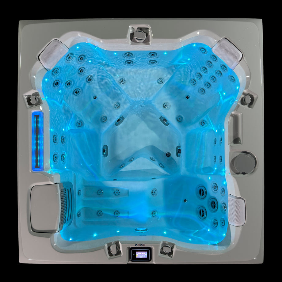 Edge Kensington Hot Tub in Dark Grey — illuminated overhead lounger view