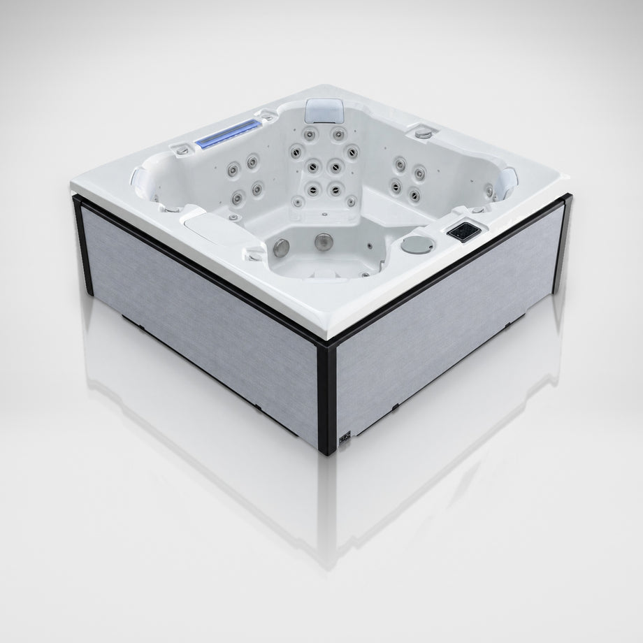 Edge Knightsbridge hot tub in light grey, angled view on a silver studio floor