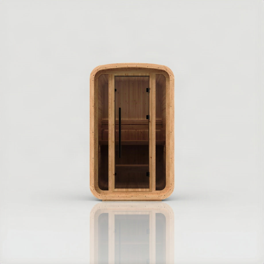 Hekla Mini Cube in Scandi thermo-spruce, front view through the glass door to the bench