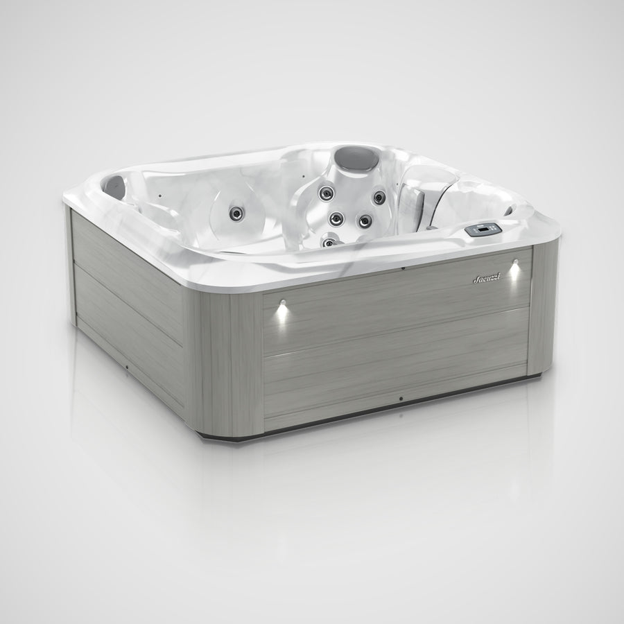 Jacuzzi J-225 hot tub in Platinum with Horizon Gray cabinet, three-quarter view