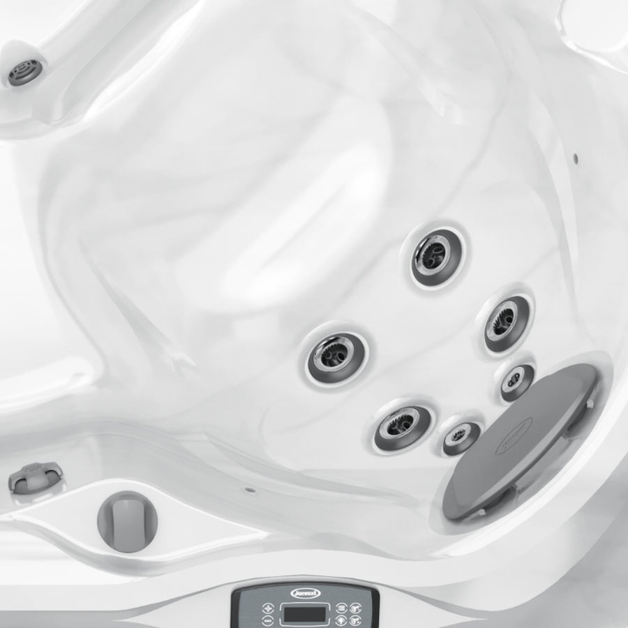 Close-up of the Jacuzzi control panel and corner seat jets on the J-245 hot tub
