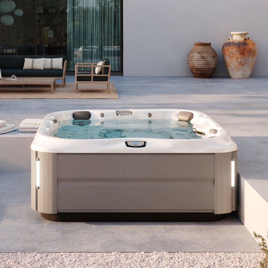 Jacuzzi J-375 hot tub on a patio (brand lifestyle image)