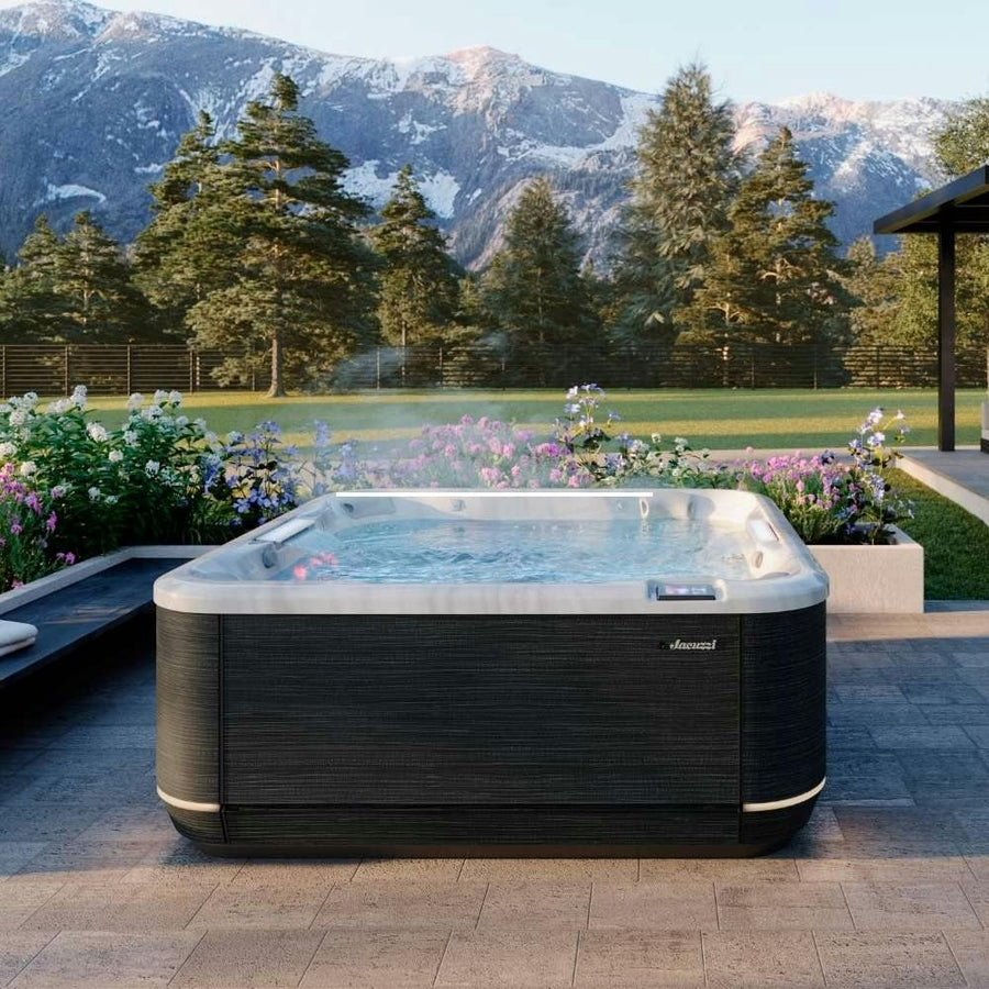 Jacuzzi J-508L hot tub with mountain views (brand lifestyle image)