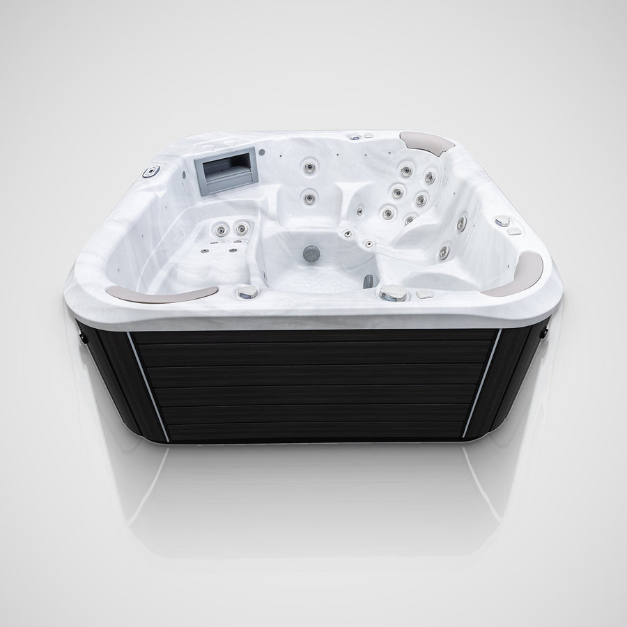 Jacuzzi S-600 hot tub seen from the side with its lounger and seats