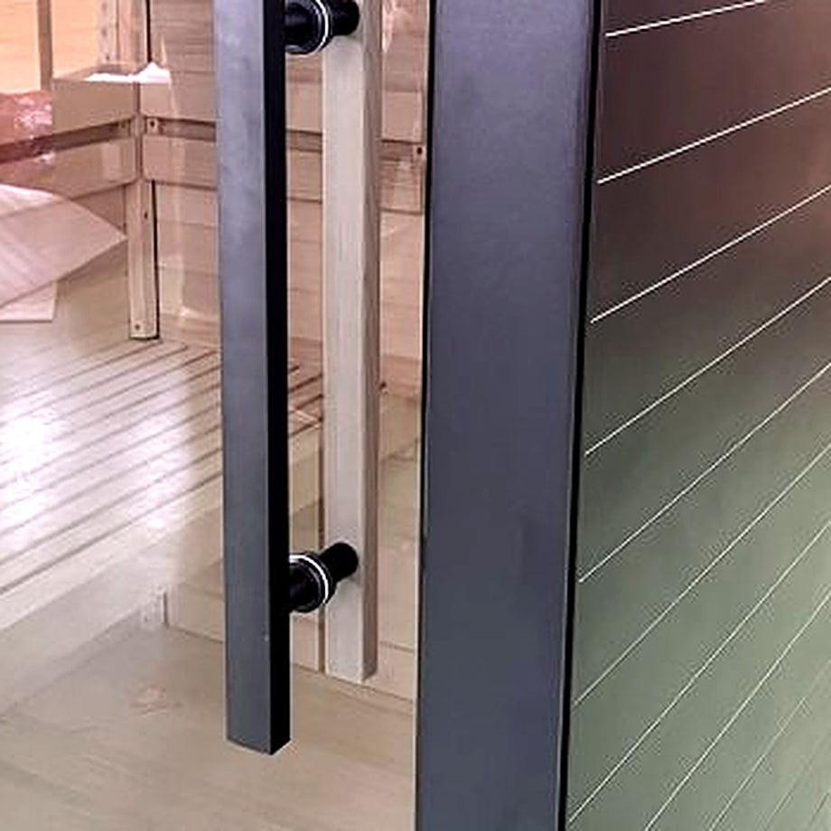 Black door handle on the glass door of the Outdoor Living Aluminium sauna