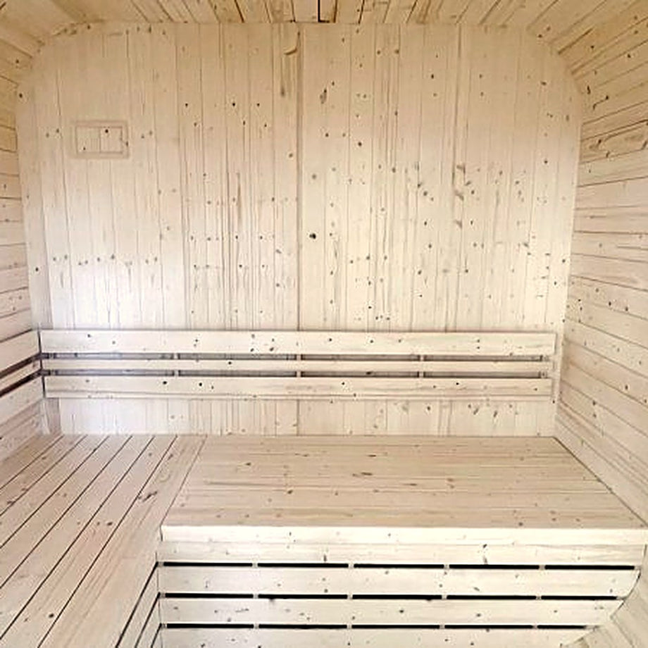 L-shaped spruce benches inside the Outdoor Living Cube sauna