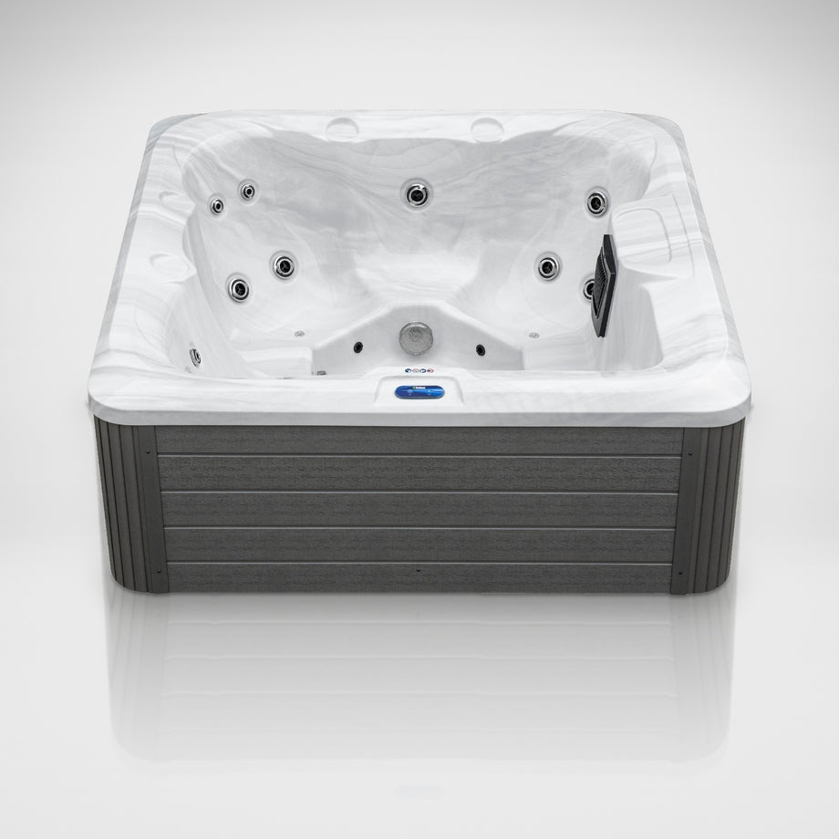 The Outdoor Living Escape hot tub seen from the front in the studio
