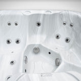 Load image into Gallery viewer, Close-up of the seats and jets inside the Outdoor Living Escape hot tub