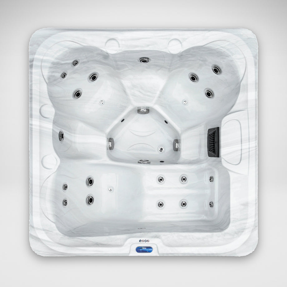 The Outdoor Living Escape hot tub in Silver Marble seen from above, showing the lounger and seats