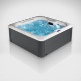 Load image into Gallery viewer, The Outdoor Living Hideaway hot tub filled with the jets running