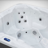 Load image into Gallery viewer, Close-up of the seats, jets and guest control panel inside the Outdoor Living Hideaway hot tub