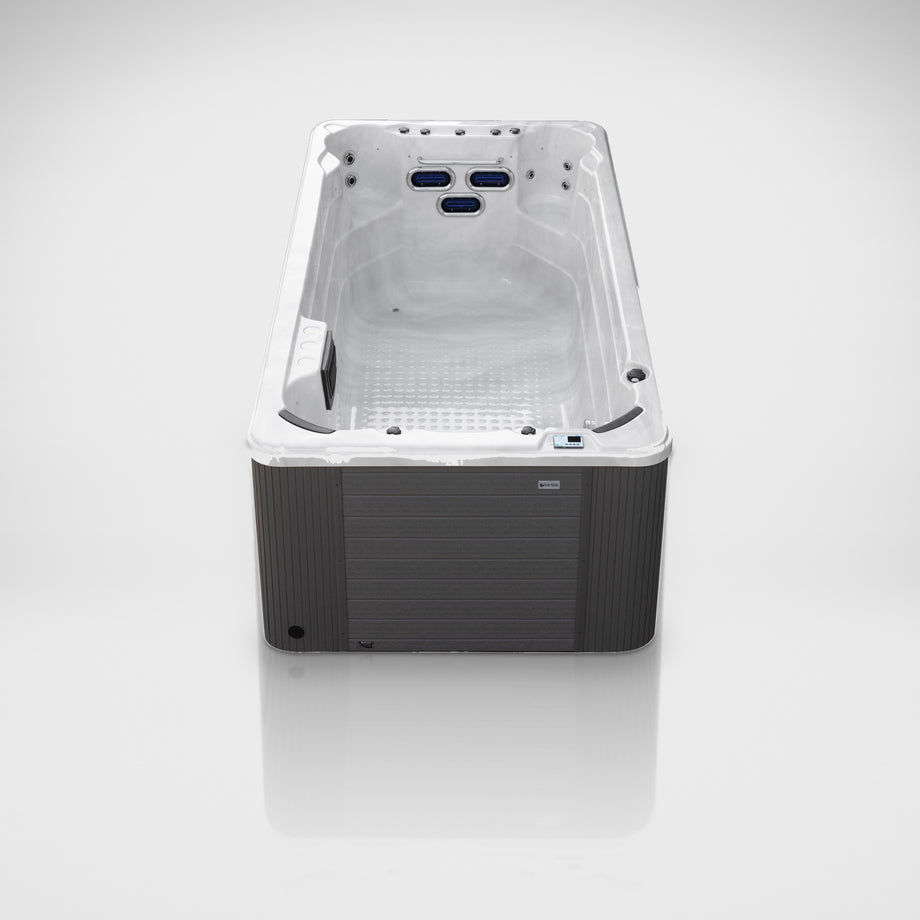 Outdoor Living Active Pro 15ft swim spa on a silver studio floor, view 1