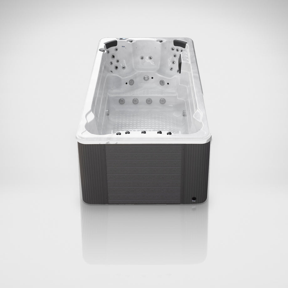 Outdoor Living Active Pro 15ft swim spa on a silver studio floor, view 5
