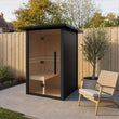 Load image into Gallery viewer, Illustrative lifestyle view of the Outdoor Living aluminium outdoor sauna on a UK garden patio
