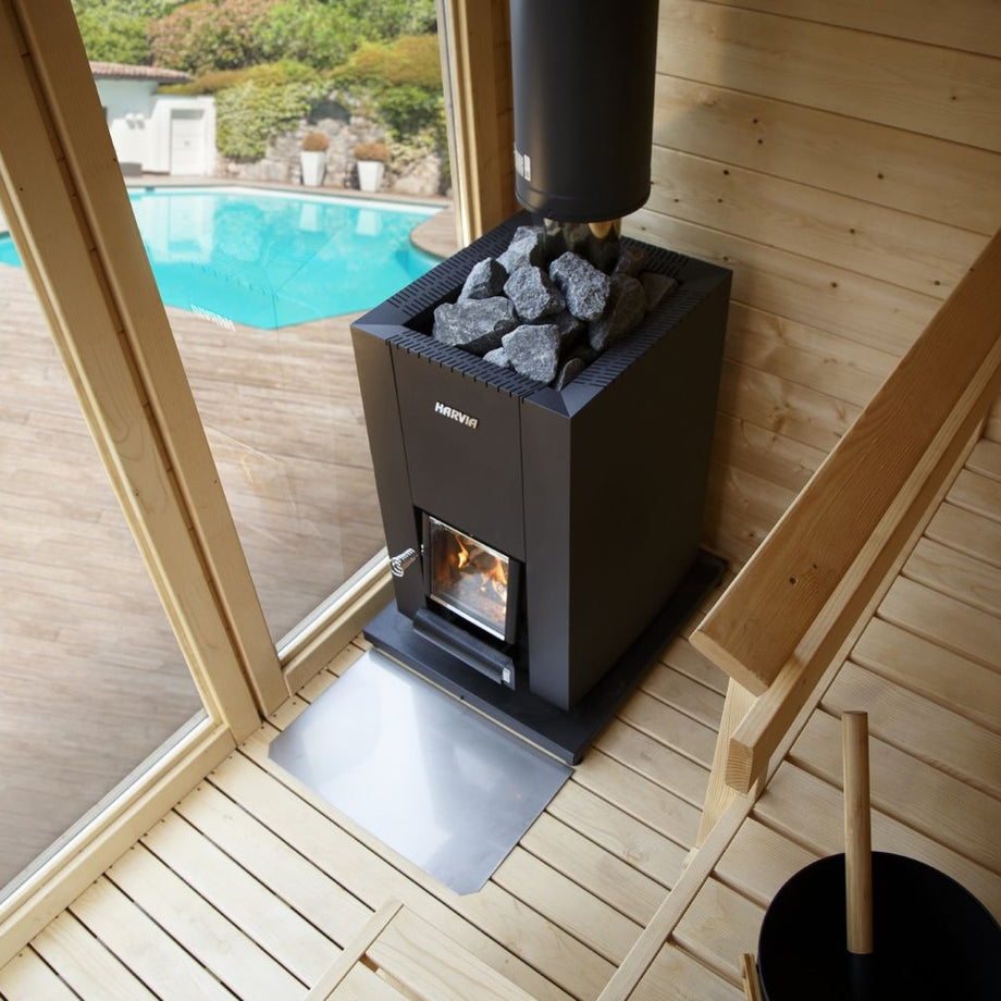 Harvia Linear 18 Compact stove inside a glass-fronted garden sauna