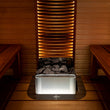Load image into Gallery viewer, Harvia The Wall heater fitted under a sauna bench with lighting
