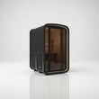 Load image into Gallery viewer, Hekla Mini Cube outdoor sauna in black Nero finish, angled view showing the glass front and shingle roof
